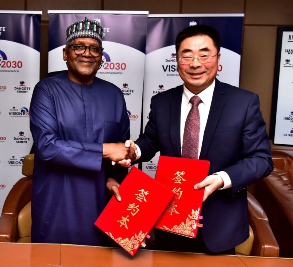 Aliko Dangote and Sinoma International Chairman Lin Zhong during the signing of the $800 million Itori Cement Plant expansion agreement.